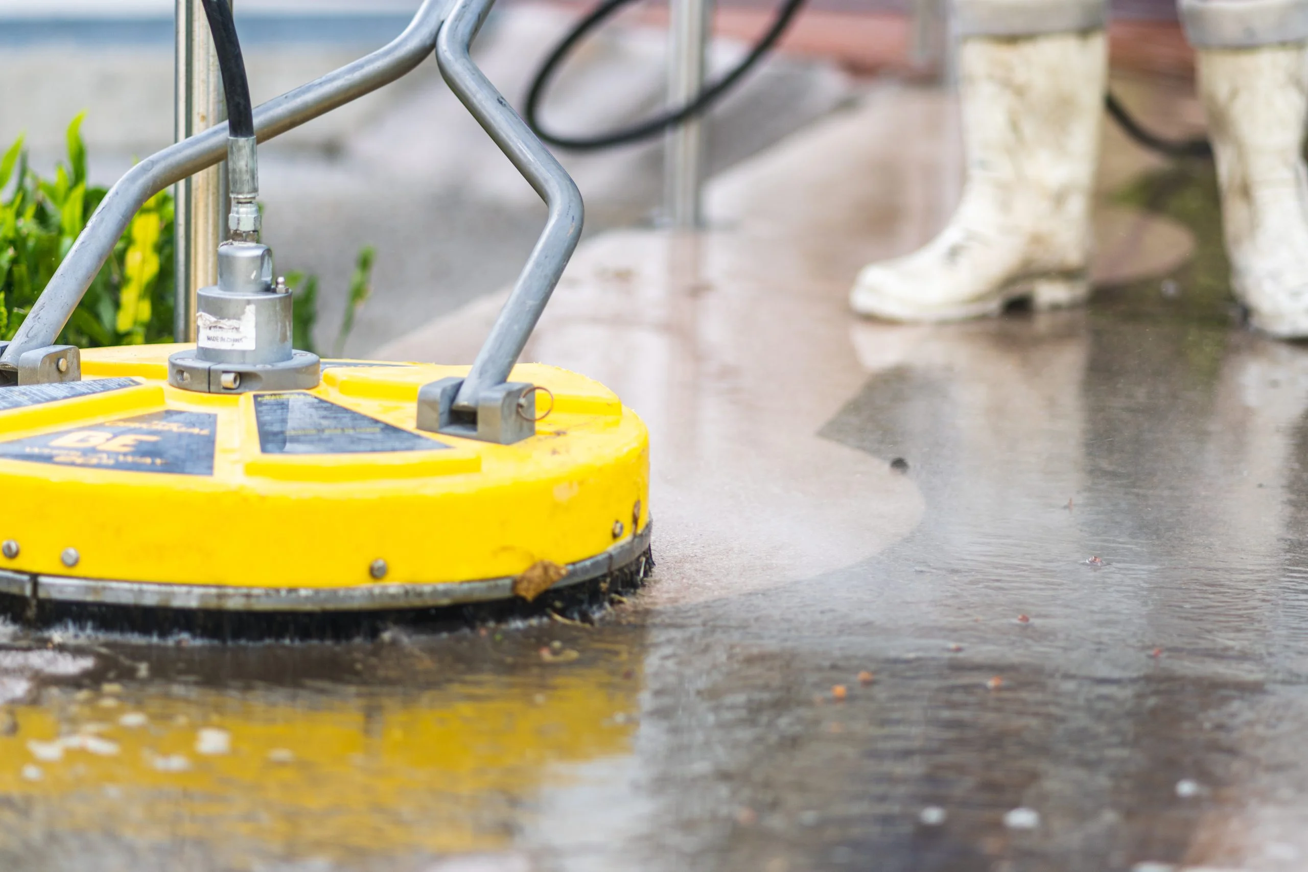 Pressure washing concrete sidewalk