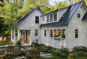 pressure washed white house in the fall