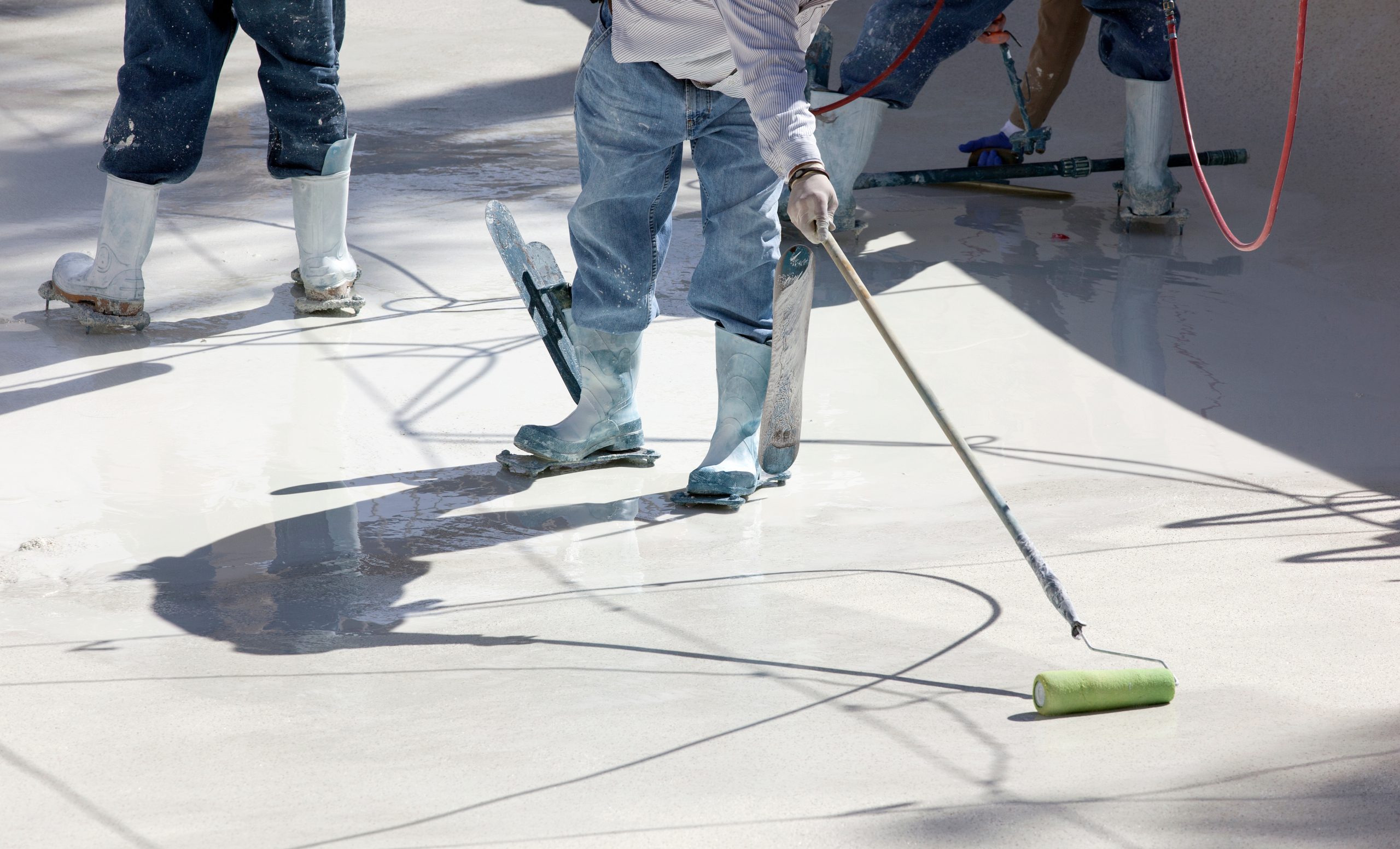 A swimming pool being resurfaced and epoxy coating